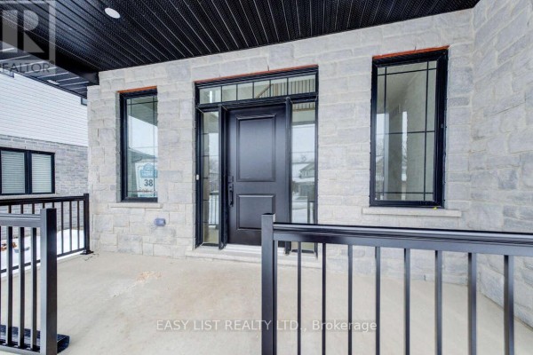 Close-up of the front entrance with stone walls and black door. - 487 Black Street, Centre Wellington