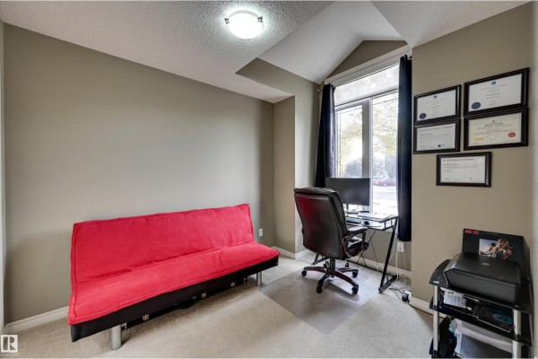 Office room with red futon, desk, chair, computer, printer, and diplomas on wall. - #49 10 Woodcrest Ln, Fort Saskatchewan