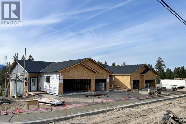 Townhouse units under construction with exposed wood framing and Tyvek wrap. - 4906 Thouret Road, Out Of Province_alberta
