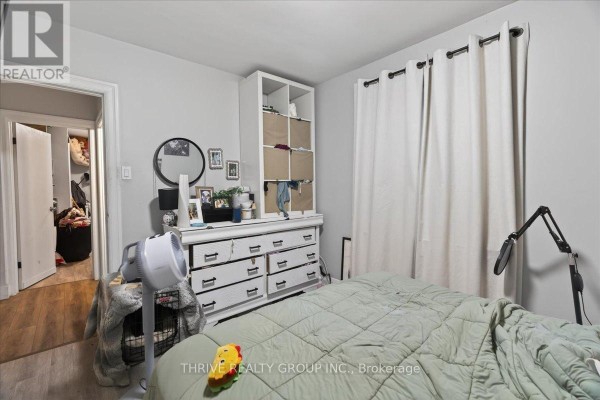 Bedroom with dresser, open closet, fan, and bed - 494 Highbury Avenue N London East