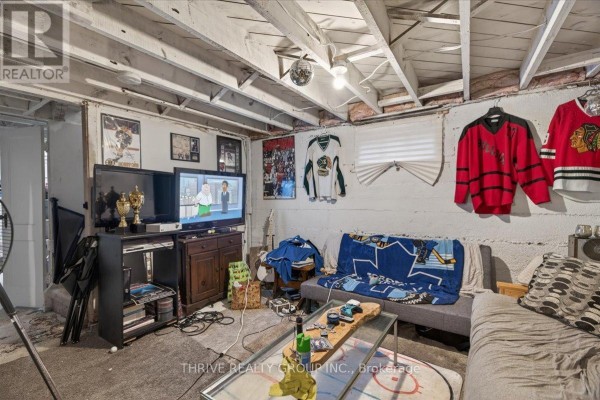 Basement with disco ball, TVs, trophies, and hockey jerseys - 494 Highbury Avenue N London East