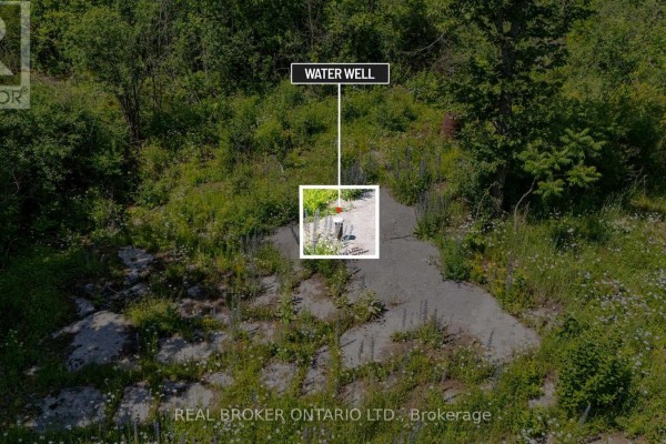 Aerial view of 6.46 acres at 4983 Stonecrest Road with wooded areas and a drilled well. - 4983 Stonecrest Road, Ottawa