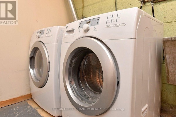 White front-load washer and dryer with digital displays - 499 Valley Drive N Oakville