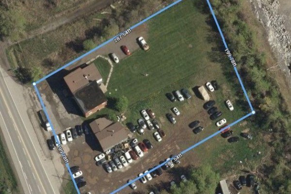 Aerial map showing property boundaries, buildings, grass, and parked cars. - 4997 & 4991 Bank Street, Ottawa