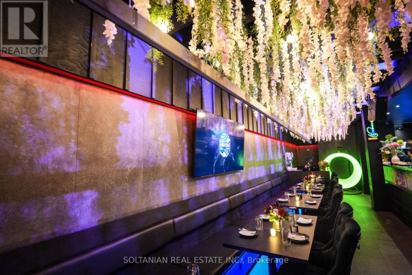 Nightclub with colorful spotlights, balloons, and illuminated circular logos on the walls. - 5 - 5 Glen Cameron Road, Markham