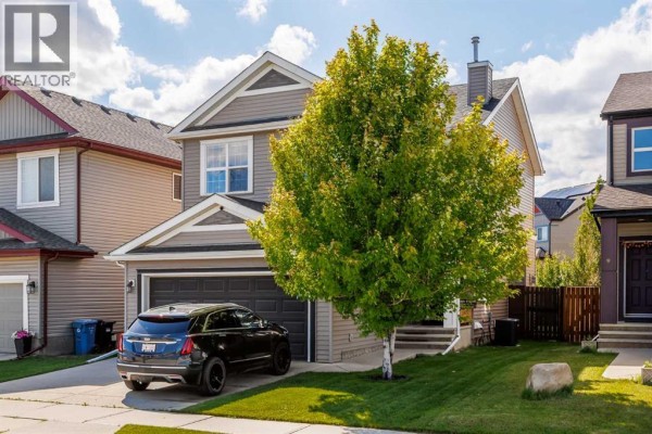 Close-up of the covered front porch with a black front door and steps. - 5 Copperpond Link Se, Calgary