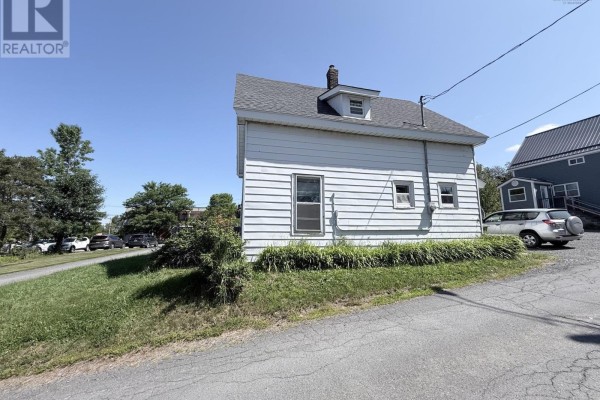 Side exterior view of a white two-story house with clapboard siding and a chimney. - 5 Fraser Lane, Trenton