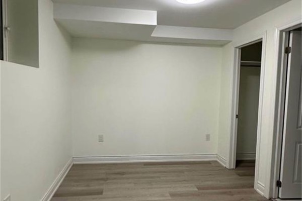 A small room with white walls, a closet, and light grey wood-look flooring. - 5 Munro Circle Unit# Lower, Brantford