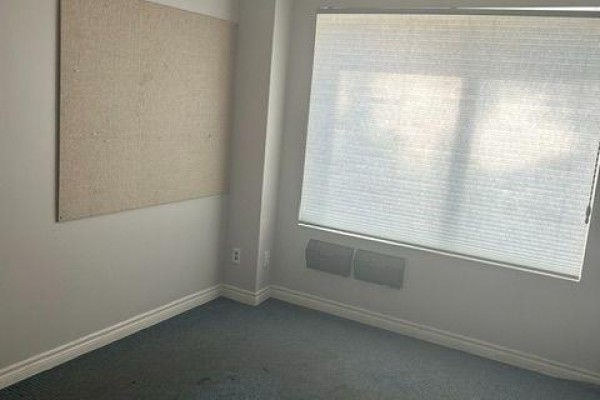 Office or storage room with blue carpet, cork board, and large window with blinds. - 5 To 8 - 112 Saunders Road, Barrie
