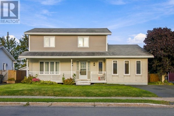 Two-story home with light brick and beige siding, white porch and trim. - 5 Trafalgar Drive, Mount Pearl