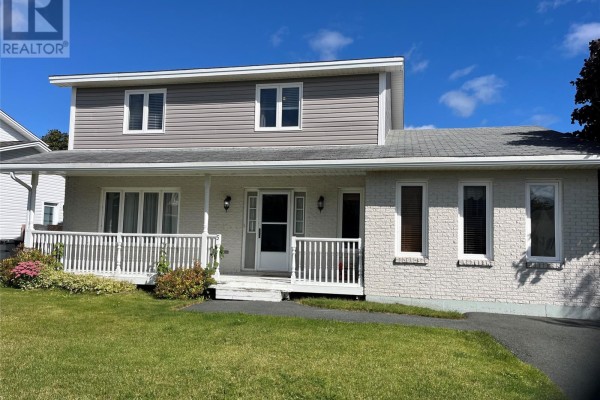 Two-story home with light brick and grey siding, white porch and trim. - 5 Trafalgar Drive, Mount Pearl