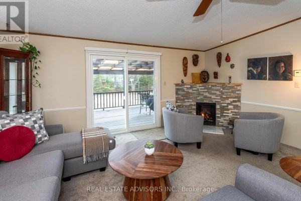 Kitchen with island, granite counters, and stainless steel appliances - 50 Juno Crescent Georgina