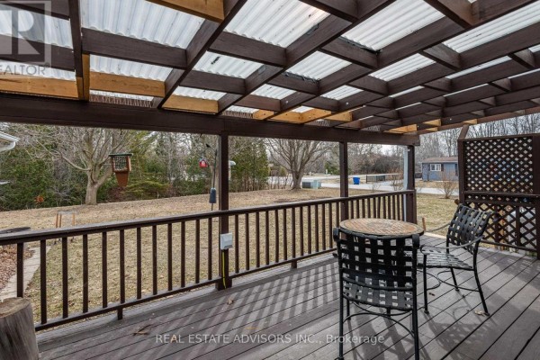 Living room with fireplace, sectional sofa, and deck access - 50 Juno Crescent Georgina