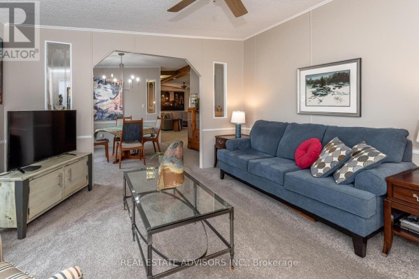 Beige bungalow with sunroom & double garage - 50 Juno Crescent Georgina