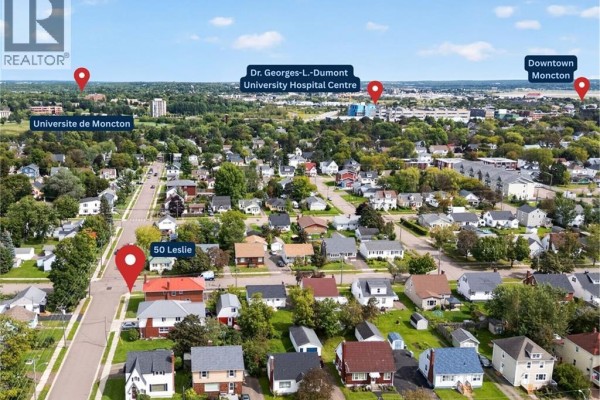 Aerial view of 50 Leslie, Moncton, with surrounding homes, schools, and hospitals labeled. - 50 Leslie, Moncton