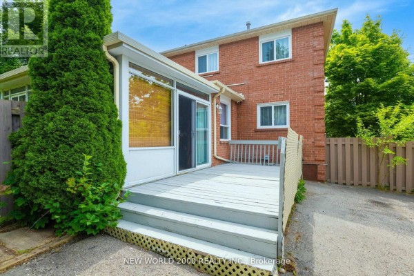 Wooden deck and brick exterior with sliding glass door - 50 Livingstone Street W Barrie
