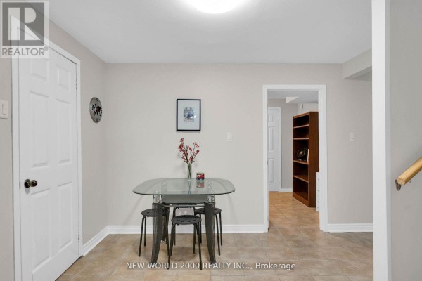 Glass dining table with chairs, wall clock, and picture - 50 Livingstone Street W Barrie