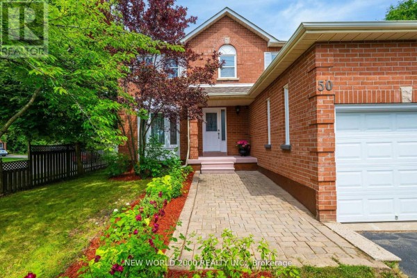 Brick house with paved walkway, garage, and garden - 50 Livingstone Street W Barrie