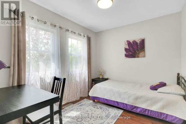 Bedroom with bed, desk, and window - 50 Livingstone Street W Barrie