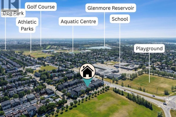 Aerial view highlighting nearby amenities like golf course, reservoir, and schools. - 5014 22 Street, Calgary