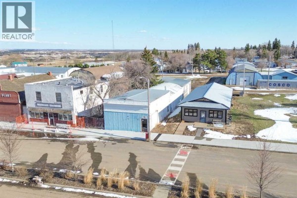 Aerial view of commercial buildings on Main Street, Donalda, with varied architecture. - 5015 Main Street, Donalda