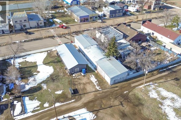 Aerial view of commercial buildings and undeveloped land on Main Street, Donalda. - 5015 Main Street, Donalda