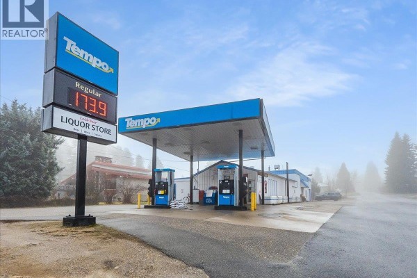 Tempo gas station with digital price sign showing regular fuel at 173.9 and liquor store. - 502 12th Avenue, Genelle