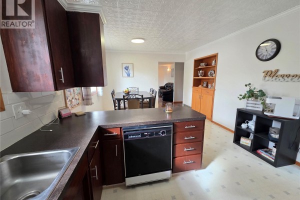 View from the kitchen towards the dining area and living room. - 503 Thompson Street, Herbert