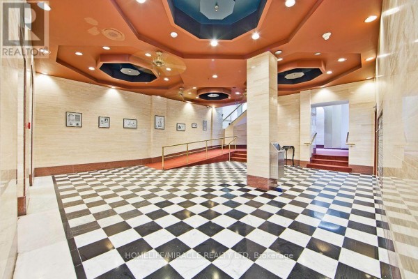 Building lobby with black and white checkered floor and cream colored walls. - 505 - 36 James Street S, Hamilton