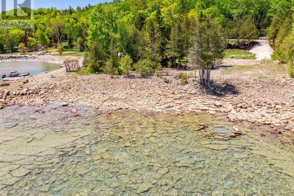 Overhead view of the waterfront lot outlined in red, adjacent to Grey Road 1 and Georgian Bay. - 505107 Grey Road 1, Georgian Bluffs