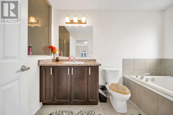 Bathroom vanity, sink, toilet, and bathtub - 506 Brooks Street Shelburne