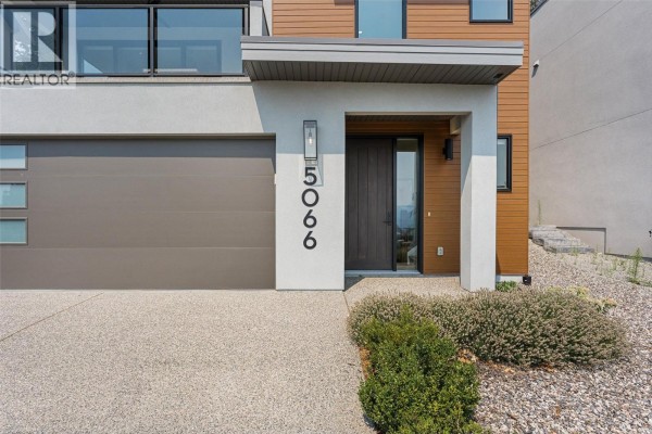 Expansive view of Okanagan Lake and rolling hills from a high vantage point. - 5066 Morrison Court, Peachland