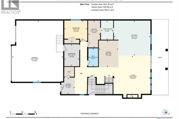 Main floor plan of a house showing living room, dining room, kitchen, pantry, bedroom, mudroom, garage, and foyer. - 508 South Shore Link, Chestermere