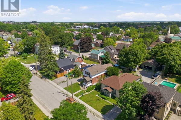 Aerial view showing the back of the house, detached garage, and backyard. - 51 Melbourne Street W, Kawartha Lakes
