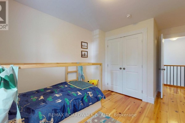 Bedroom with bunk bed and wooden floors - 51 Ormond Street Brockville