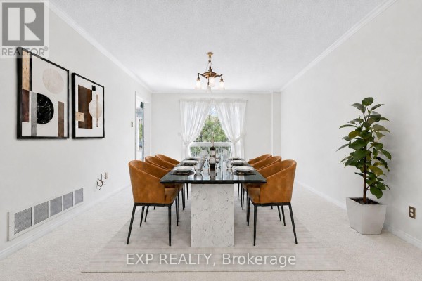 Dining room with large table and orange chairs - 51 Sanderson Crescent Richmond Hill
