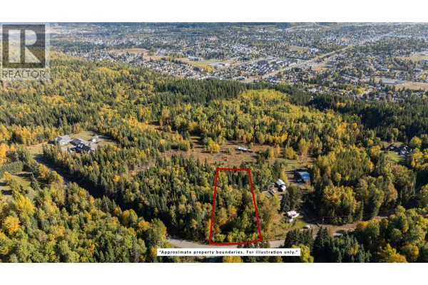 Overhead view of a treed property parcel with red boundary lines and scattered buildings. - 5102 Cranbrook Hill Road, Prince George