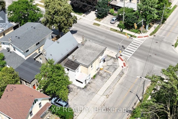 Overhead view of the commercial property at 511 Quebec Street, showing surrounding streets and houses. - 511 Quebec Street, London East