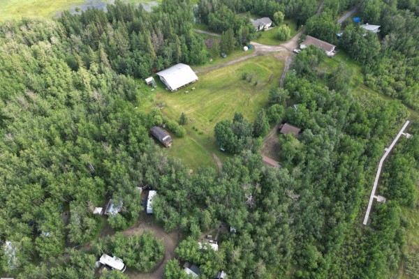 Aerial view of RVs parked amongst bare trees on a rural property. - 51380a Rge Road 205, Rural Strathcona County