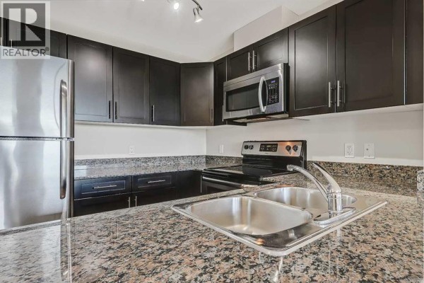 Living room - 514, 955 Mcpherson Road Ne, Calgary, AB T2E6V3 Photo 4