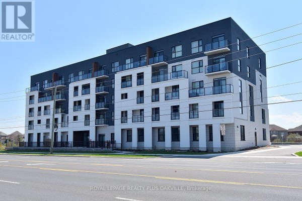 A side view of the contemporary apartment building showcasing its architecture and balconies. - 514 - 1936 Rymal Road E, Hamilton