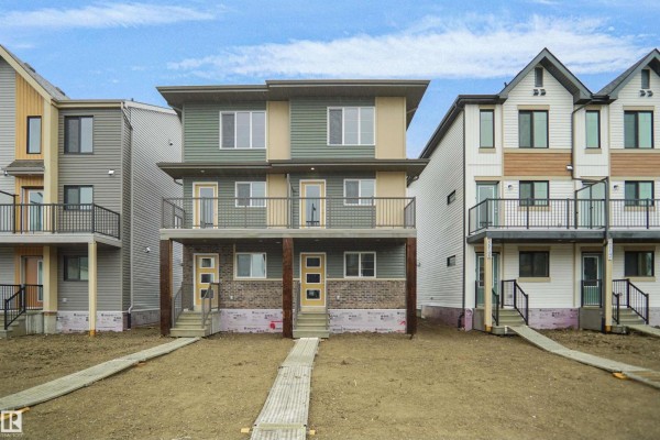 Exterior view of duplex with modern design and balcony - 5143 River's Edge Wy Nw, Edmonton