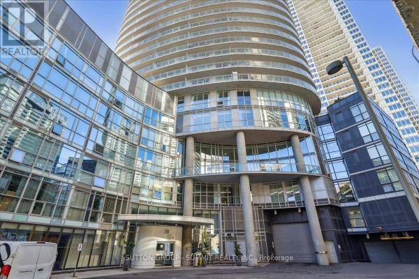 Modern condo exterior with glass facade and curved balconies - 515 - 38 Dan Leckie Way Toronto