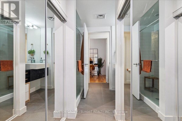 Modern bathroom with double vanity and glass showers - 515 - 38 Dan Leckie Way Toronto