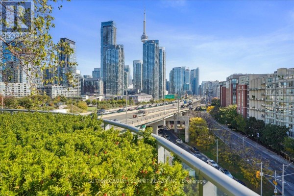 Toronto skyline view with CN Tower over highway and greenery - 515 - 38 Dan Leckie Way Toronto