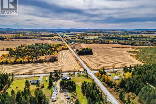 Aerial view of a rural landscape with fields, roads, and scattered buildings. - 516 Chem Rang 9 Et 10 N, Saint Quentin