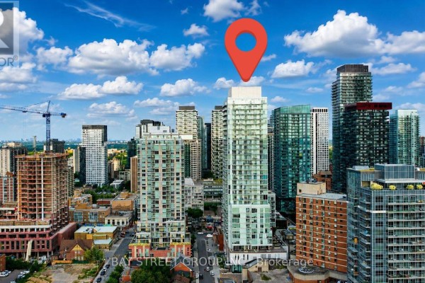 Aerial view of Toronto cityscape with numerous high-rise buildings and green spaces. - 517 - 33 Helendale Avenue, Toronto