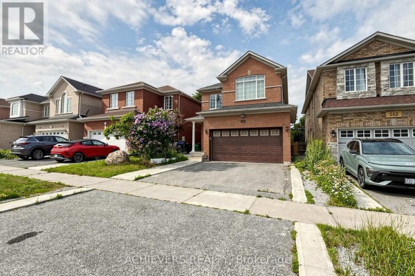 Street view of the house with neighbors on either side and cars parked in driveways. - 517 Navigator Drive, Mississauga