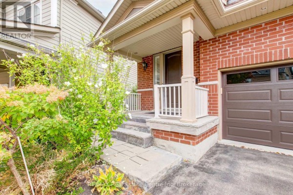 Close-up of the front porch steps and entrance to the house, with brick exterior. - 52 Bardoe Crescent, Milton