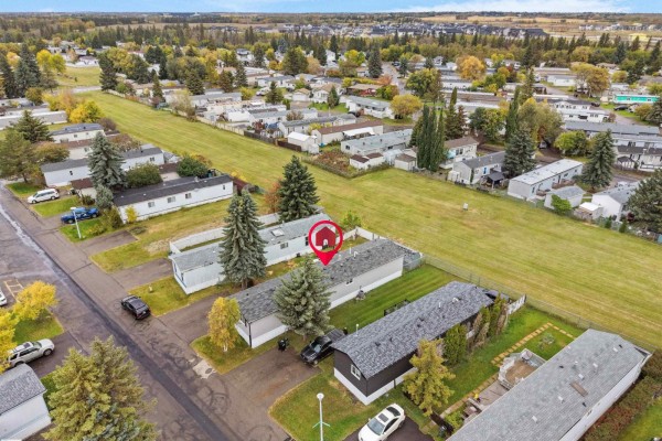 Aerial view showing the property and surrounding mobile homes in a neighborhood setting. - 52 Evergreen Park Nw, Edmonton